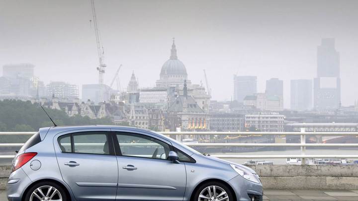 Vauxhall Corsa Side Pose In Blue Near Buildings